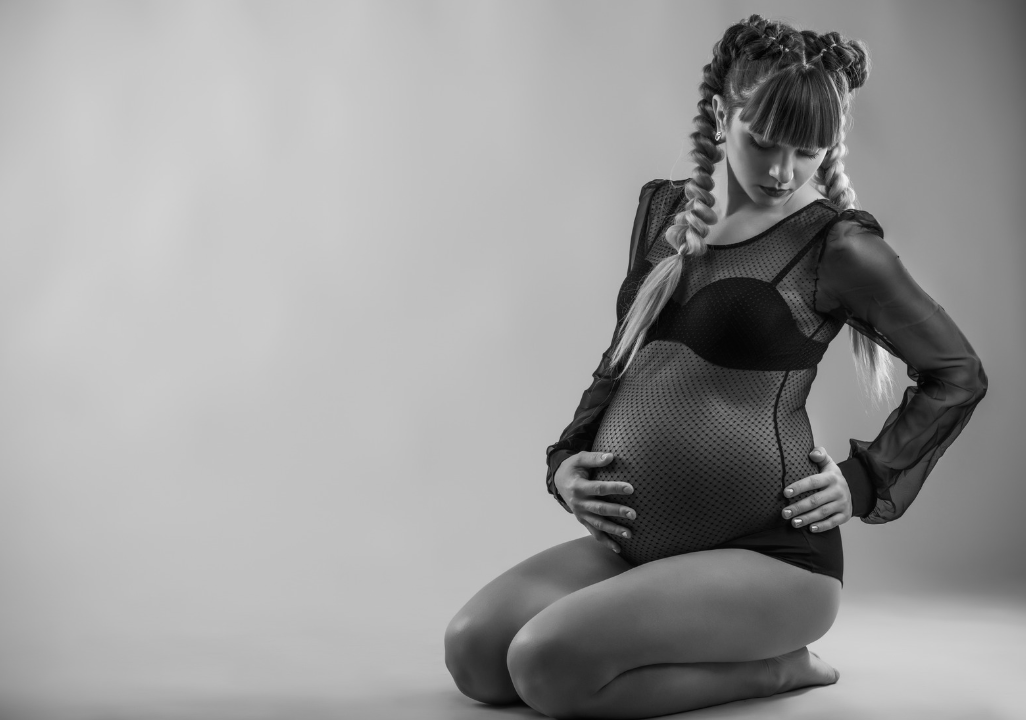 pregnant woman sitting on her knees